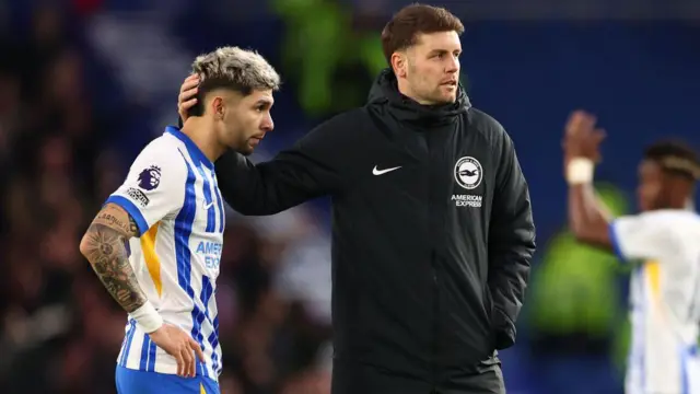 Brighton & Hove Albion manager Fabian Hurzeler with a dejected Julio Enciso