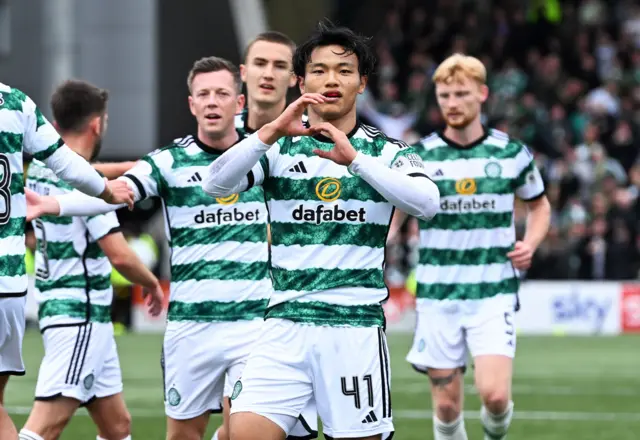 Celtic celebrate after Reo Hatate scores a penalty against Livingston