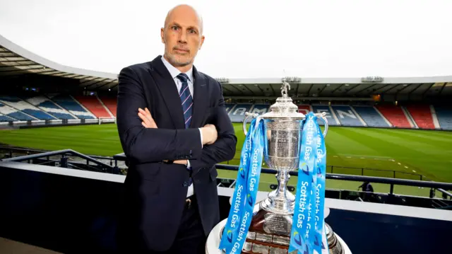 Clement poses with the Scottish Cup at Hampden