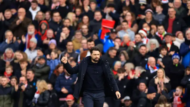 Russell Martin applauds the Southampton fans