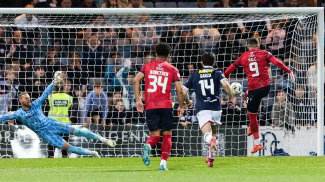 Hale thunders in his late penalty equaliser