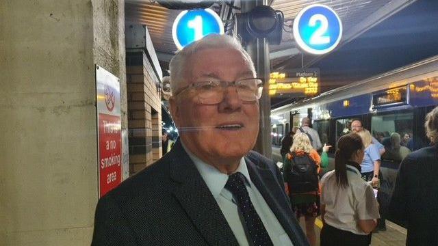 Man standing on train platform