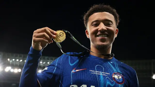 Jadon Sancho poses with his Winners' medal