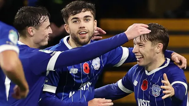 Trey George of Cardiff City celebrates scoring a goal with team-mates