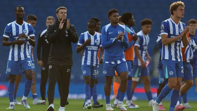 Fabian Hurzeler and several Brighton players applaud fans at Amex Stadium