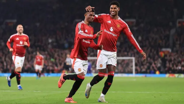  Amad Diallo celebrates with Marcus Rashford