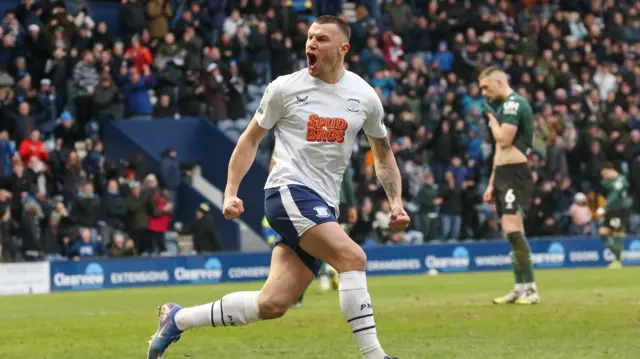 Milutin Osmajic celebrating his goal against Watford with a Hornets player holding his shirt to his face in disappointment in the background