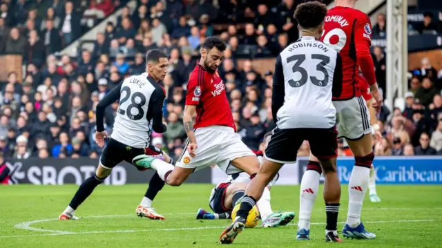 Bruno Fernandes takes a shot against Fulham