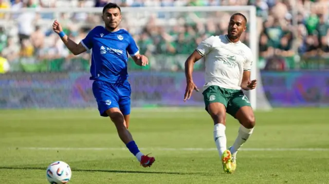 Malisheva's Vusal Isgandarli and Hibernian's Jordan Obita