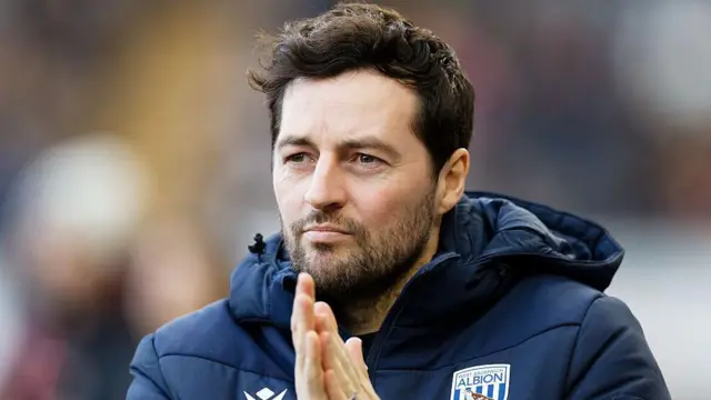 Former West Brom head coach Ryan Mason rubs his hands together