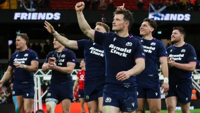 Scotland players celebrate after beating Wales