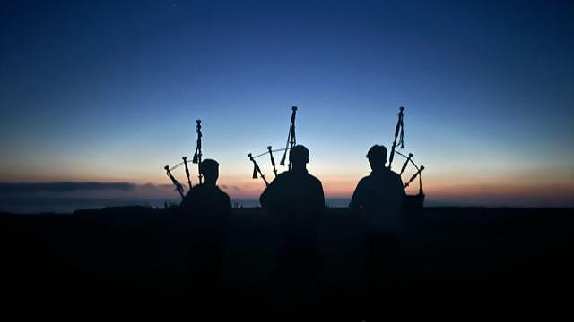 Young pipers from the Isle of Barra playing at a community event on Borve Machair.

