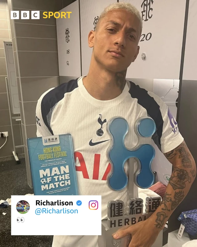 Richarlison poses with a Man of the match award after Tottenham's friendly win over Arsenal. He applies the 'eyes' emoji to the image.