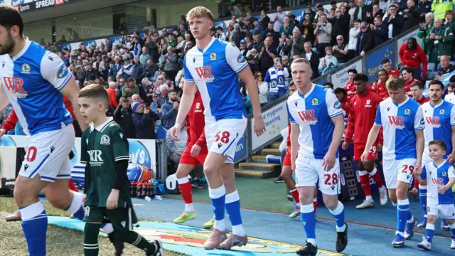 Blackburn defender Tom Atcheson walks out alongside his Rovers team-mates before the 0-0 draw with Middlesbrough
