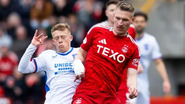 Rangers' Connor Barron and Aberdeen's Ante Palaversa