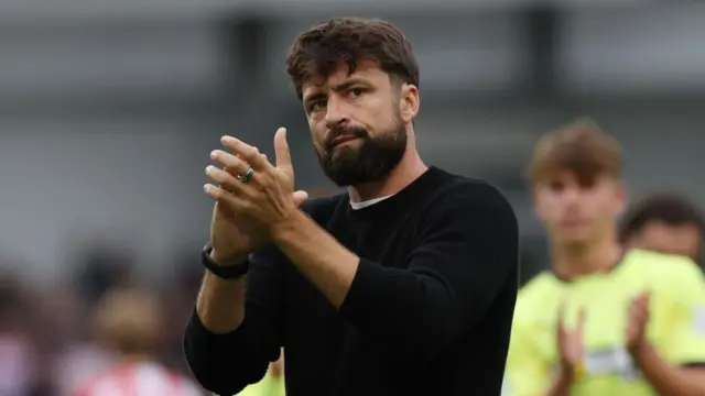 Russell Martin, Manager of Southampton, applaud the fans