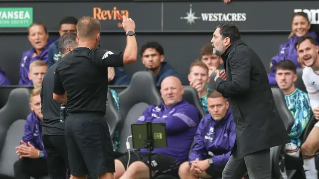 Erol Bulut is shown a red card at Swansea