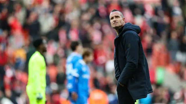 A photo of Nicky Hayen looking up at the stands during a match between Standard de Liege and KRC Genk in May