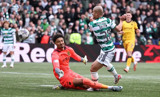 Livingston goalkeeper Shamal George makes a save to deny Celtic's Daizen Maeda