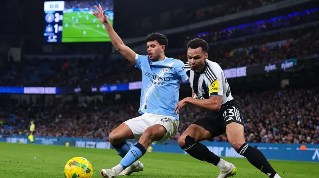 Matheus Nunes and Jacob Murphy vie for possession