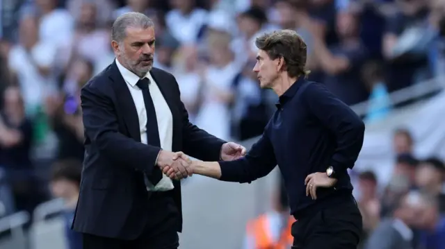 Ange Postecoglou and Thomas Frank shake hands after the Premier League match between Tottenham Hotspur FC and Brentford FC at Tottenham Hotspur Stadium