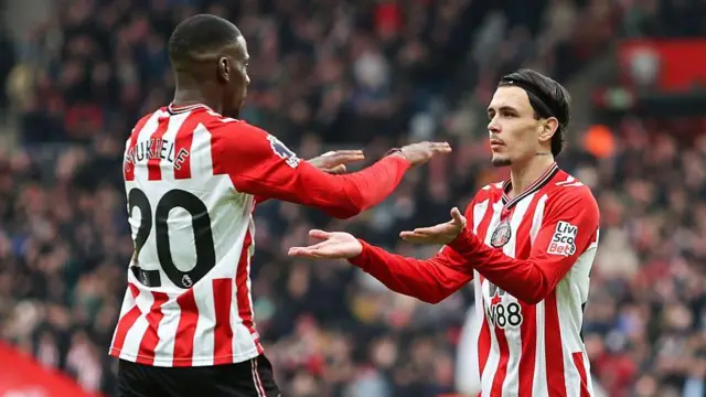 Nordi Mukiele and Enzo Le Fee celebrate