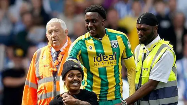 A smiling Souleyman Mandey engages with a fan at the end of Albion's 2-1 final-day defeat by relegated Sheffield Wednesday at Hillsborough 