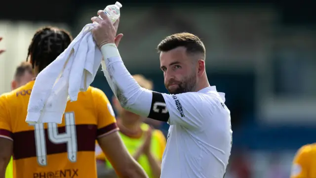 Liam Kelly applauds the Motherwell fans