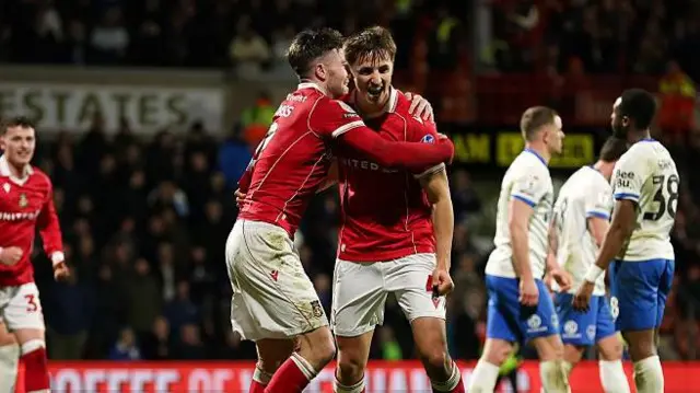 Wrexham defender Max Cleworth celebrates