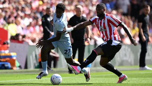 Southampton's Cyle Larin and Stoke City's Djibril Soumare battle for the ball during their Championship match on Saturday