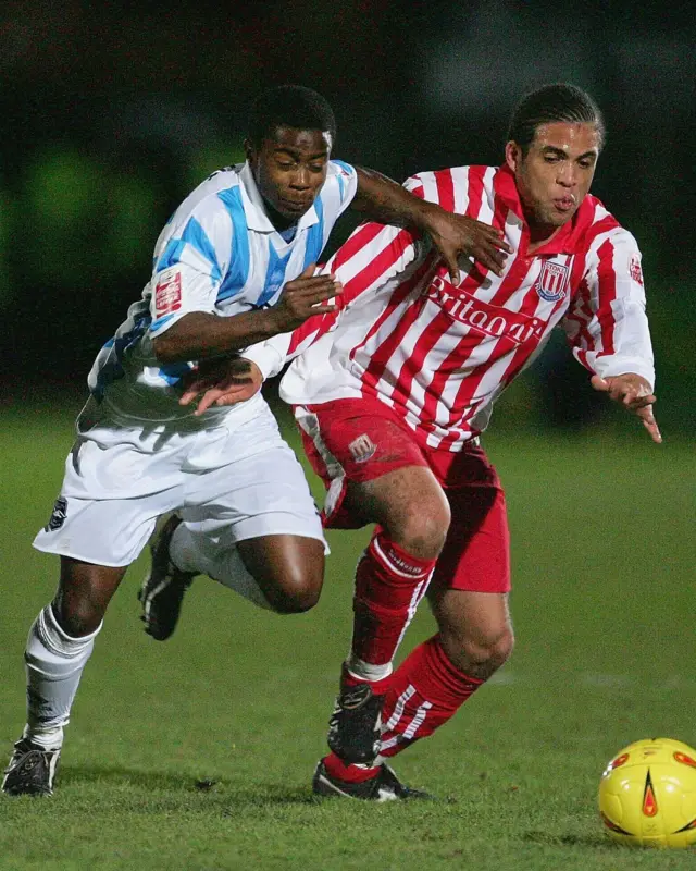 Stoke City's Darrell Russell fights for possession