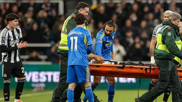 Fabian Schar is taken off on a stretcher during Newcastle United's game against Leeds United at St James' Park on 7 January, 2026