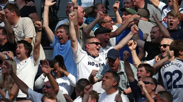 Tottenham Hotspur fans celebrate their goal