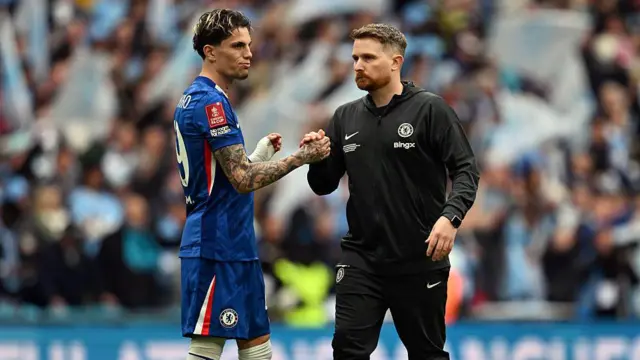 Chelsea interim boss Calum McFarlane embraces Garnacho after a loss at Wembley