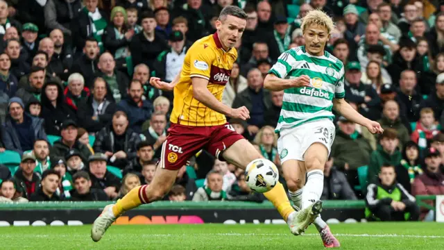 Motherwell's Paul McGinn and Celtic's Daizen Maeda