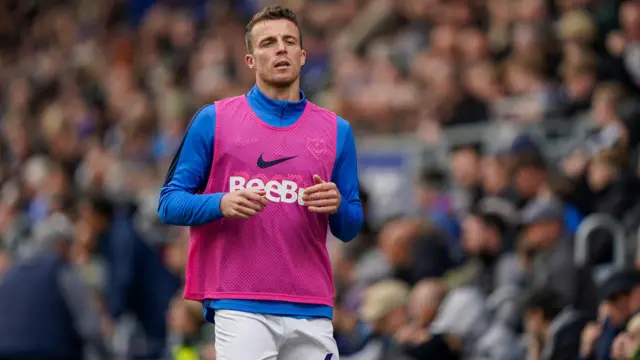 Conor Shaughnessy warms up on the sidelines 