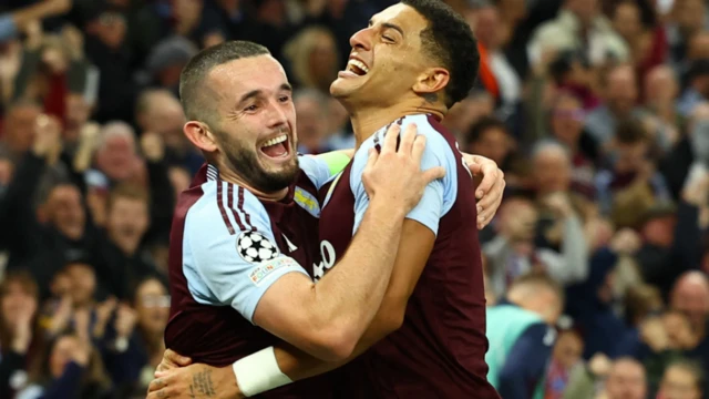 Aston Villa's players celebrate after scoring against Bologna