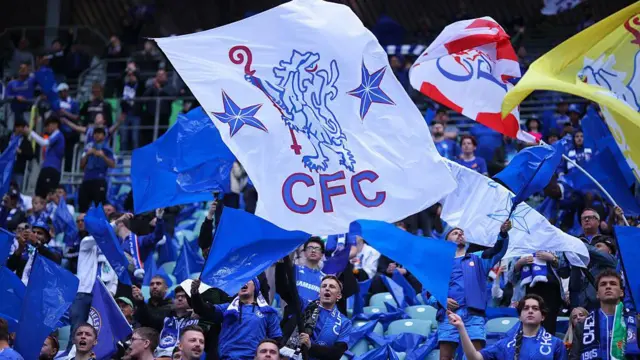 Chelsea fans wave banners