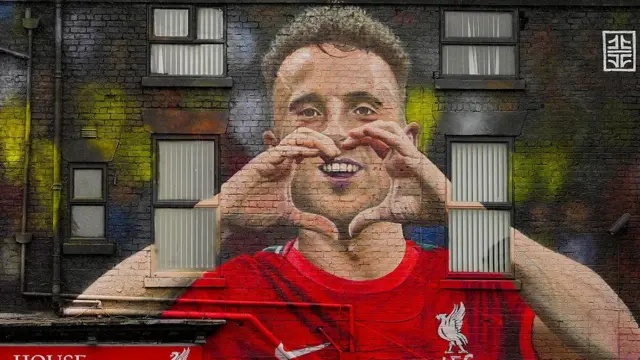 A new mural by artist John Culshaw depicting Diogo Jota celebrating a goal by creating a heart with his fingers
