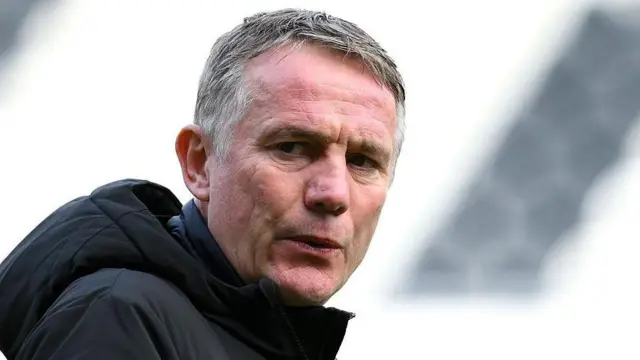 Phil Parkinson looks on from the touchline