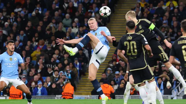 Erling Haaland watches ball before attempt on goal