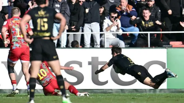 Toulon scrum-half Baptiste Serin scores a try against Harlequins