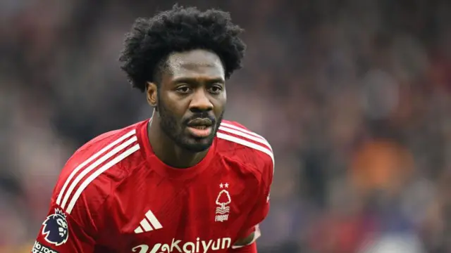 Ola Aina in the red Nottingham Forest shirt of 2024/25