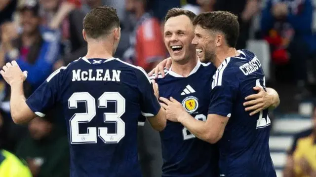Scotland's Kenny McLean, Lawrence Shankland and Ryan Christie celebrate
