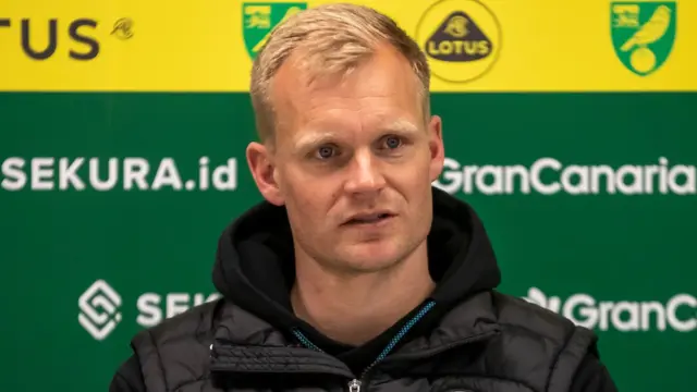 Liam Manning in the Norwich City press room while Bristol City boss