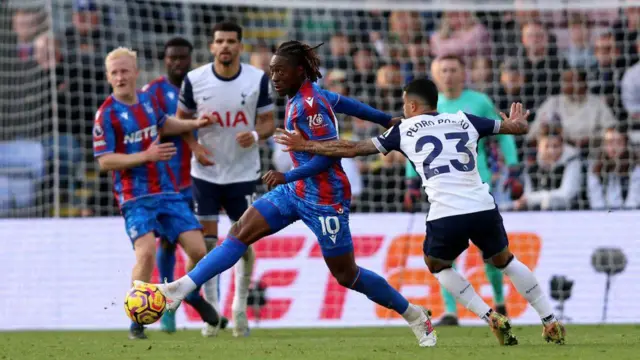 Eberechi Eze of Crystal Palace controls the ball whilst under pressure from Pedro Porro of Tottenham Hotspur during the Premier League match between Crystal Palace FC and Tottenham Hotspur FC 