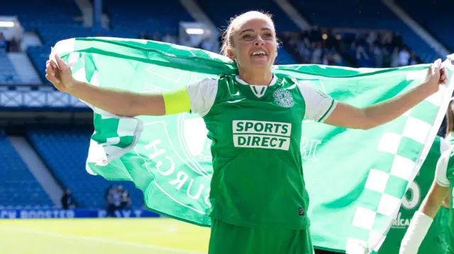 Hibernian’s Kirsten Reilly celebrates at full time during a Scottish Women's Premier League match between Rangers and Hibernian at Ibrox Stadium