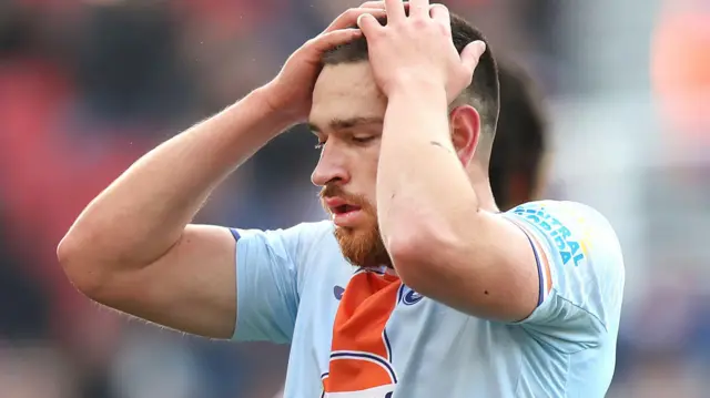 Zan Viptonik holds his head in his hands during Swansea's loss at Stoke 