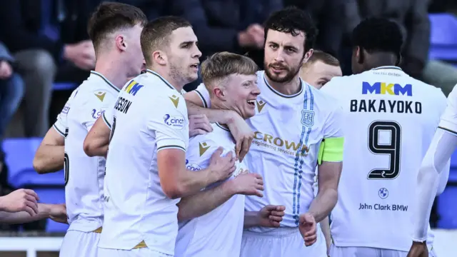 Dundee players celebrate with Lyall Cameron after his goal