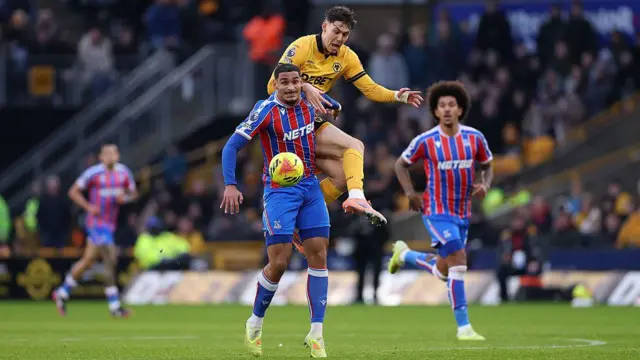Maxence Lacroix and Jorgen Strand Larsen compete for the ball